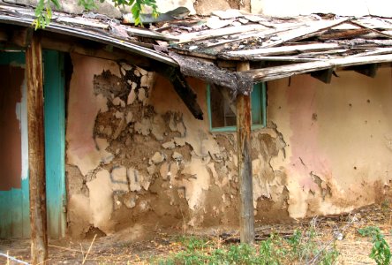 decaying adobe house