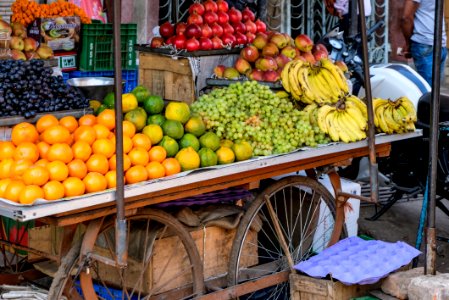 Street Vendor Selling Fruits on His Fruit Cart