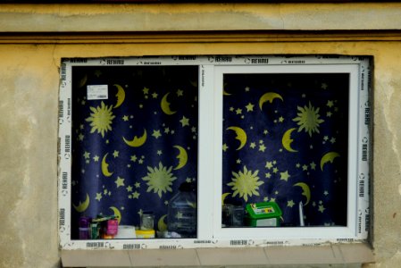 Closeup on a Window with Blue Night Curtains photo