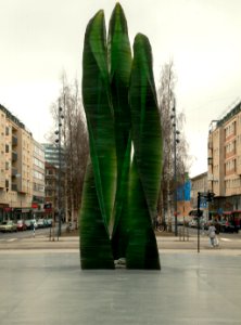 statue-outdoor-large-tall-green-glass-flames-reach-for-sky-b photo