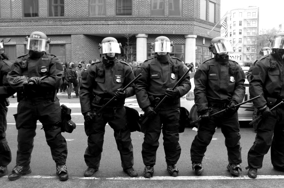 Riot police stand in front of protestors at Trump Inauguration in Washington DC