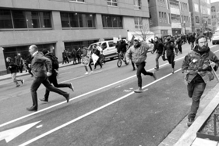 Protestors at Trump Inauguration run from riot police after they use tear gas and concussion grenades