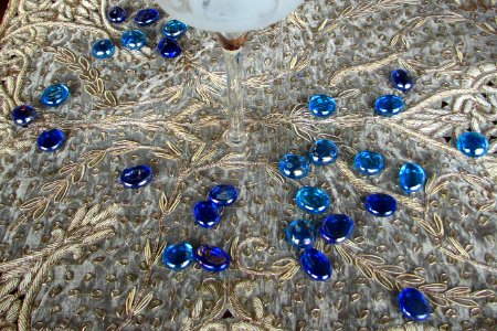 blue glass pebbles on lace photo