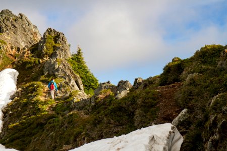 Man Hiking along Cliff on the Mt Pugh Trail, Mt Baker Snoqualmie National Forest photo