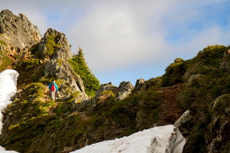 Man Hiking along Cliff on the Mt Pugh Trail, Mt Baker Snoqualmie National Forest