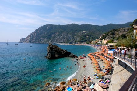 Beach Filled with Sun Umbrellas at Monterosso, Italy photo