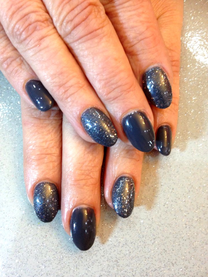 Oval acrylic nails with dark metal grey and moonshine gel polish to finish