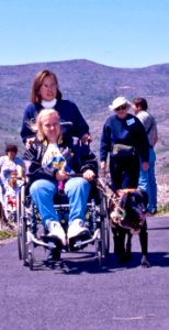Woman attendant pushing Wheelchair photo