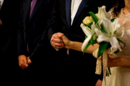 Bride and Groom Holding Hands photo