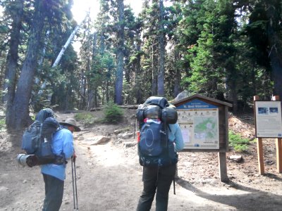 Hikers reading Mt Hood Wilderness Sign, Mt Hood National Forest photo
