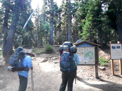 Hikers reading Mt Hood Wilderness Sign,  Mt Hood National Forest