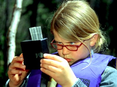 Girl examining specimen during Wolftree Outing-Deschutes