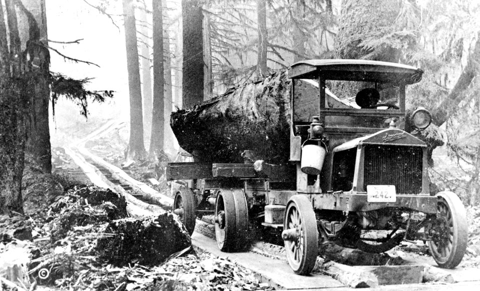 Rived Log on Truck on Plank Road