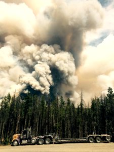Rail Fire burning behind staged equipment, Wallowa Whitman and Malheur National Forest