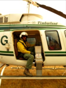 Crew member Josh on Helicopter N500G prepares for lift off Sept 14