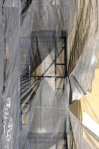 torn plastic sheeting over construction photo