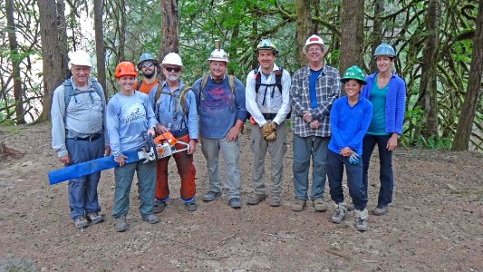 Pacific Crest Trail Association volunteers log out a portion of the still closed Eagle Creek Trail in July 2018, Columbia River Gorge NSA. Photo courtesy of PCTA