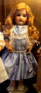 old doll with blue dress