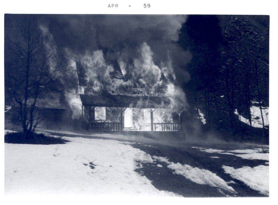 PO-40-3198- Old Denny Creek Ranger Station being burned- April 1959