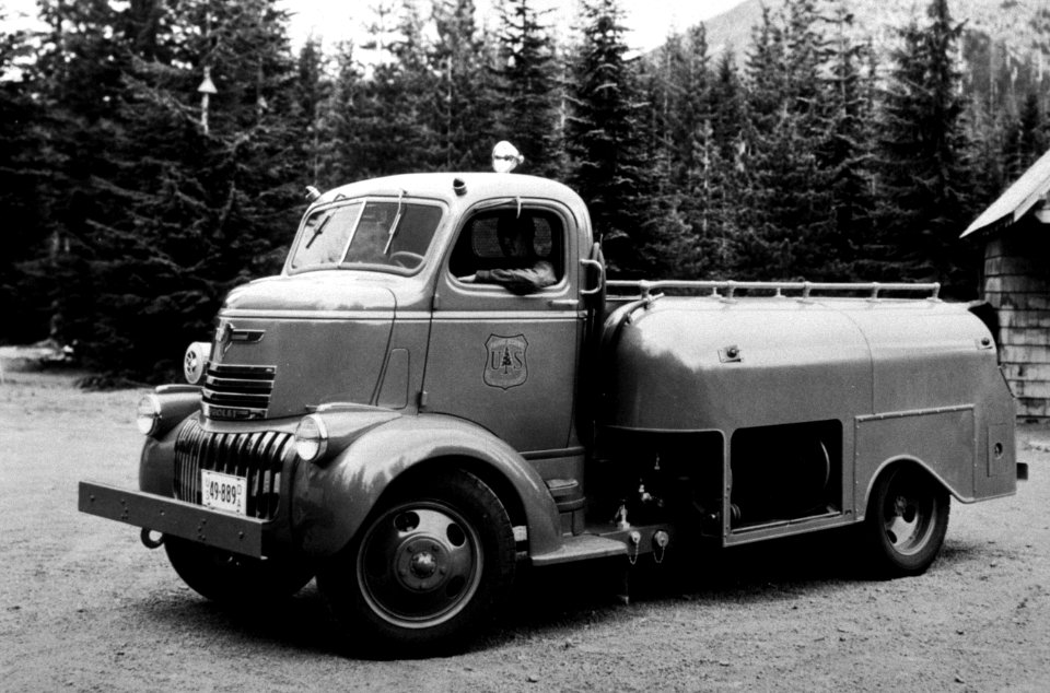 219 Ranger Wiesenanger at the wheel in the new Summit tanker, Zigzag RD Mt Hood Natl Forest 1940