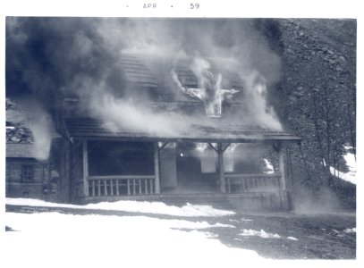 PO-40-3205- Old Denny Creek Ranger Station being burned- April 1959