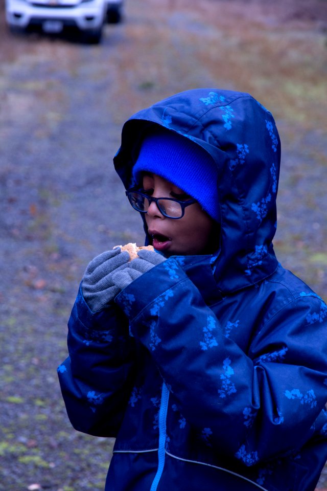 A youth enjoying s'mores at a holiday tree outing at Gifford Pinchot National Forest, November 2018.  Photo by Sandy Burks.