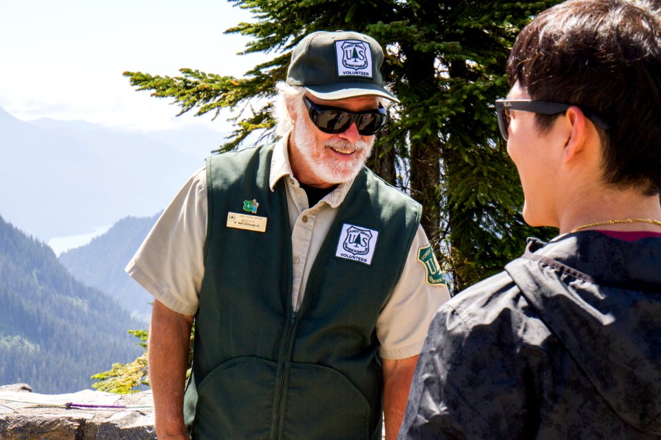 Forest Service Volunteer Ranger speaking with Visitor at Artist's Ridge, Mt Baker Snoqualmie National Forest