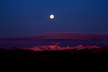 Moon set over Colorado Rockies photo