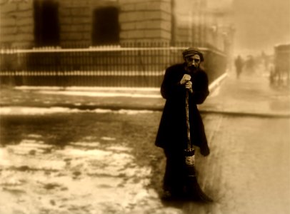 MAN SWEEPING WARM SEPIA