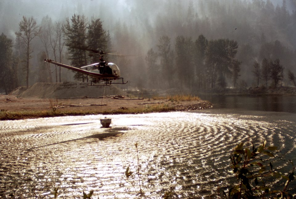 490 Entiat Fire, Wenatchee Nat'l Forest, helicopter fills bucket 1970