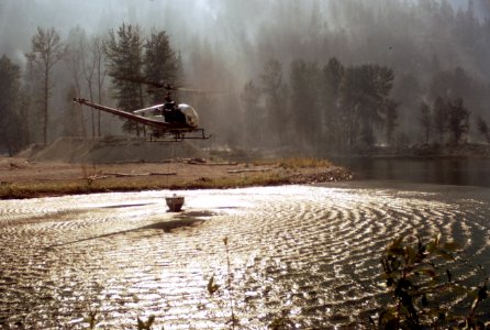 490 Entiat Fire, Wenatchee Nat'l Forest, helicopter fills bucket 1970