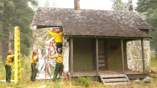 Firefighters protecting historic structure