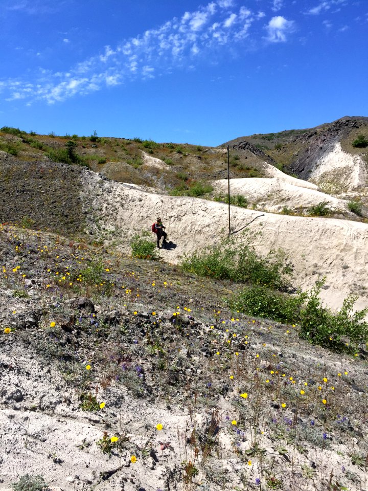 20180418 Employee monitoring historic drill casings photo shows erosion since the 1980s.