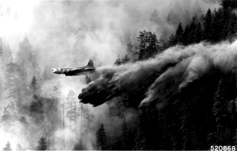 Old B-17 Air Tanker Dropping Retardent on Fire, c1960