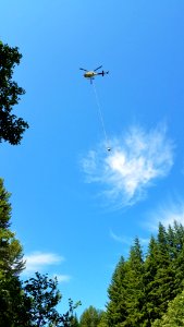 Helicopter 25HX flying water and supplies into the Spoon Fire near Lake Wynoochee July 2017, Olympic National Forest.