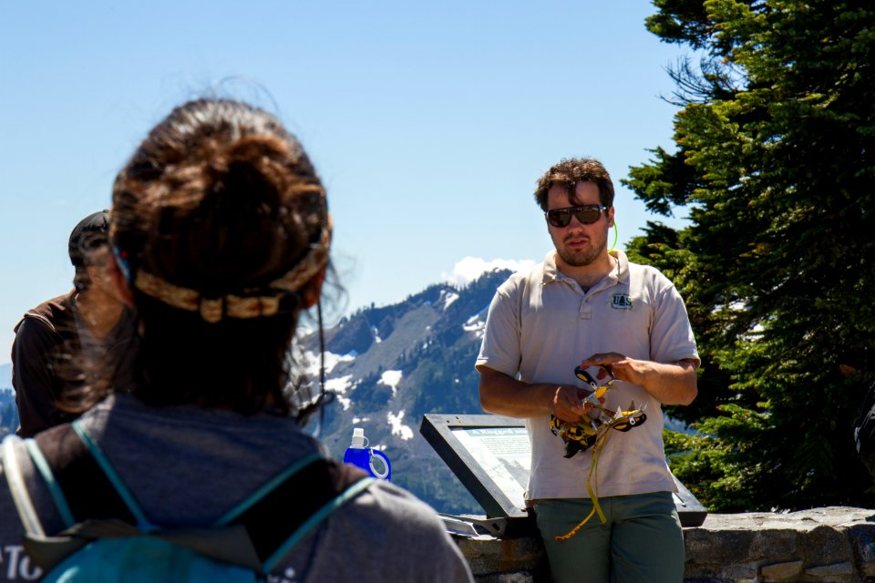 US Forest Service Ranger Demonstrating Crampons at Artist Ridge, Mt Baker Snoqualmie National Forest