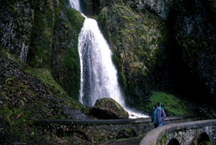 Visitor walks by Wahkeena Falls, Columbia River Gorge NSA