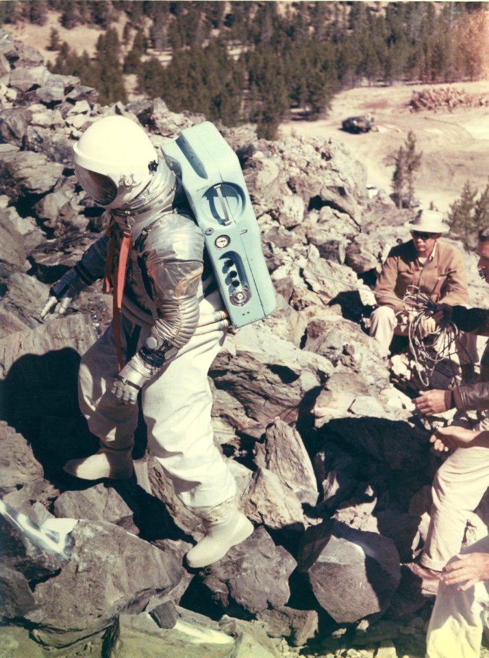 NASA astronaut R. Walter Cunningham tested mobility of the moon suit on the Big Obsidian Flow on August 27, 1964