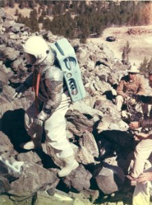 NASA astronaut R. Walter Cunningham tested mobility of the moon suit on the Big Obsidian Flow on August 27, 1964