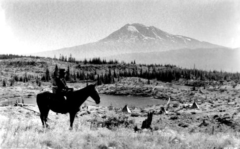 385218 Horseback rider with Mt Adams, Columbia NF, WA 1937