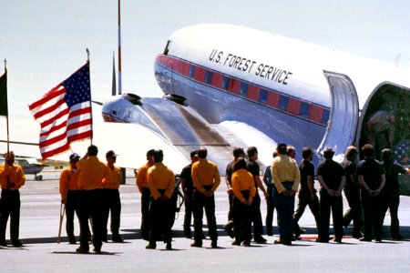 276 Honor guard formation as remains of fallen firefighters are removed from plane photo