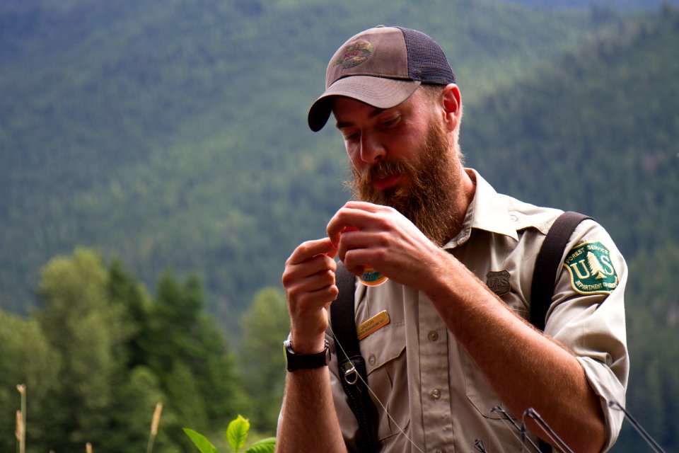 Forest Service Naturalist Baiting Fishing Line at Baker Lake, Mt Baker Snoqualmie National Forest