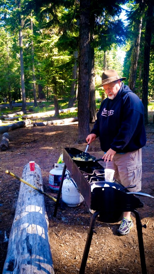 MAN COOKING AT CULTUS LAKE CAMPGROUND-DESCHUTES