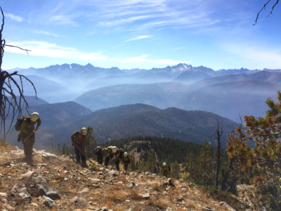 A crew builds a handline through rocky topography south of Setting Sun Mountain, Diamond Peak Fire, 2017
