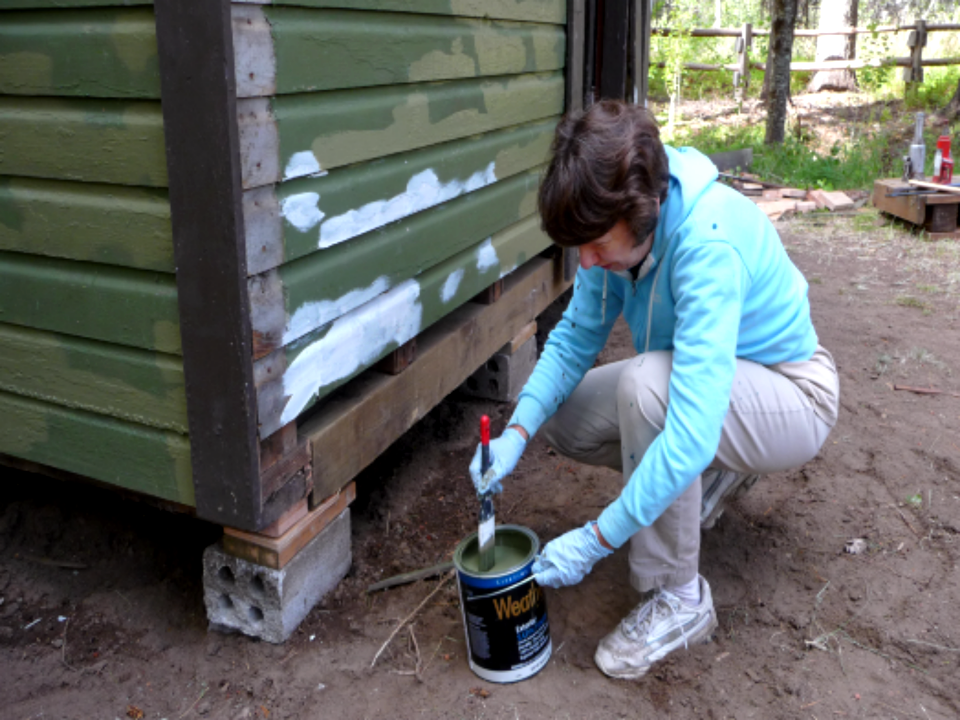 Woman Volunteer Painting Cabin, Mt Hood National Forest
