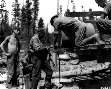 392574 CCC Filling Water Pack, Deschutes NF, OR 1936 photo