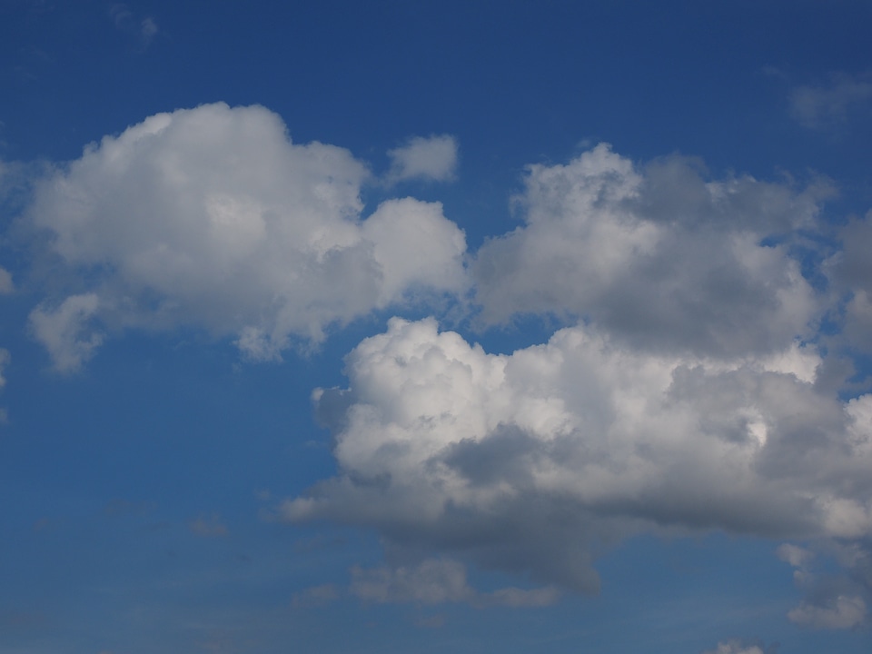 Clouds form white cumulus clouds