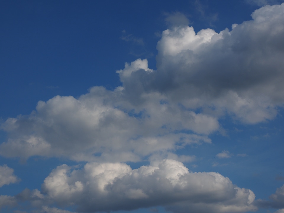 Clouds form white cumulus clouds