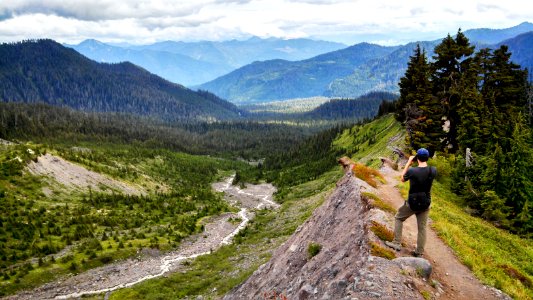 Hiker takes a photo above the PNT's crossing of Rocky Creek, Mt. Baker-Snoqualmie National Forest