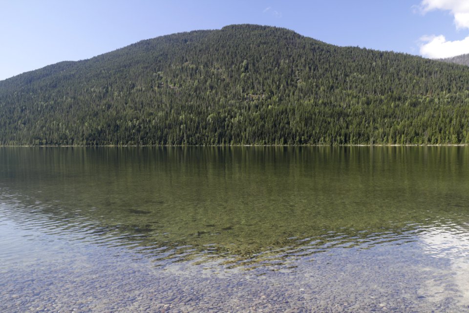 The calm water of Upper Priest Lake invites hikers to stop for a swim
